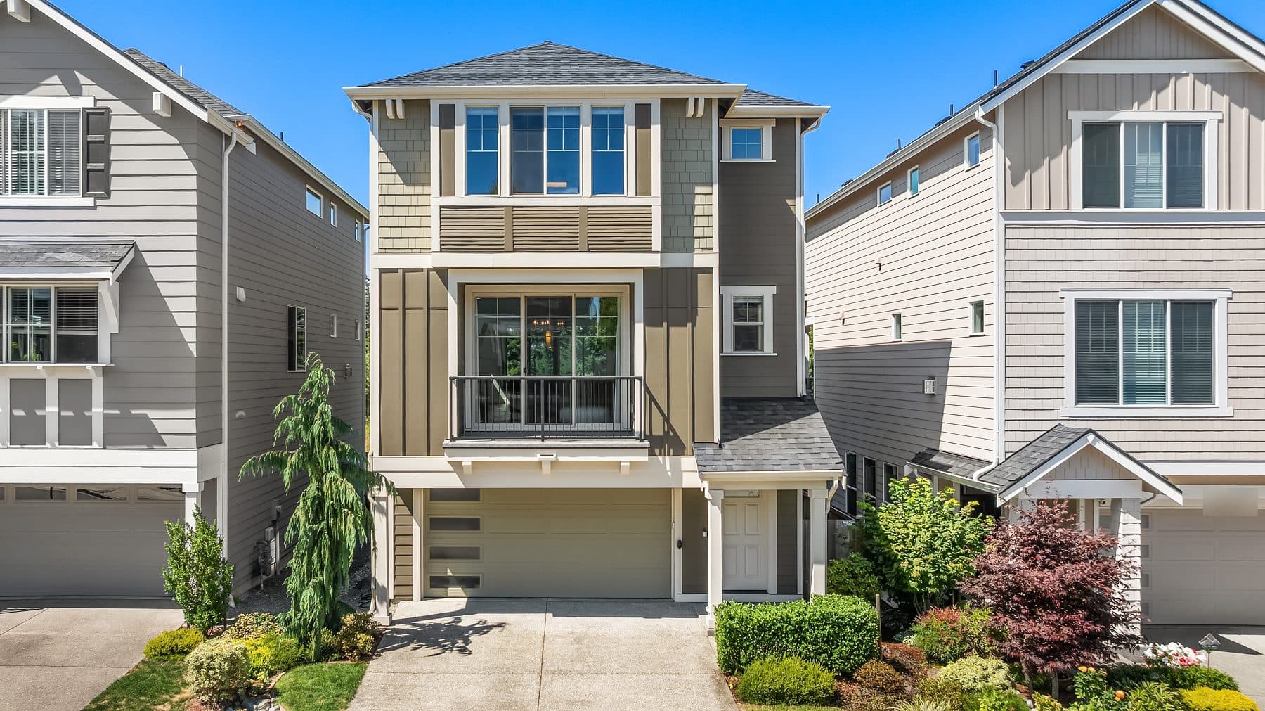 A Northwest home exterior under a clear summer sky